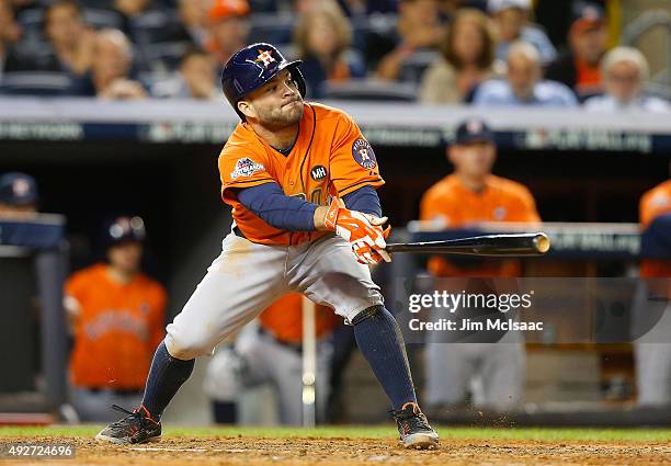 Jose Altuve of the Houston Astros connects on a RBI hit against the New York Yankees during the American League Wild Card Game at Yankee Stadium on...
