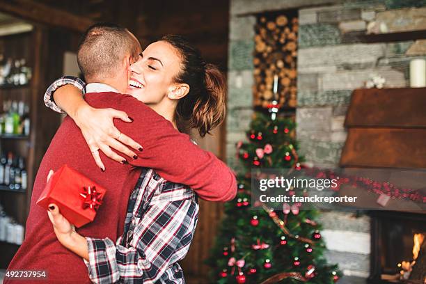 giving the present to the girlfriend - christmas giving stock pictures, royalty-free photos & images