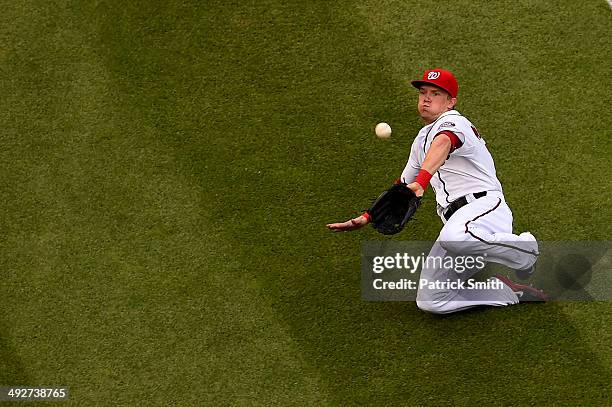 Left fielder Nate McLouth of the Washington Nationals makes a catch on Billy Hamilton of the Cincinnati Reds in the fifth inning at Nationals Park on...