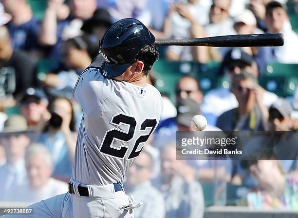 Jacoby Ellsbury of the New York Yankees fouls the ball off during the tenth inning against the Chicago Cubs on May 21, 2014 at Wrigley Field in...