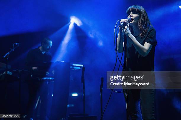 Iain Cook and Lauren Mayberry of Chvrches perform on stage at Paramount Theatre on October 14, 2015 in Seattle, Washington.