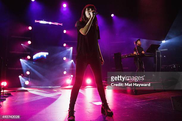 Lauren Mayberry and Martin Doherty of Chvrches perform on stage at Paramount Theatre on October 14, 2015 in Seattle, Washington.