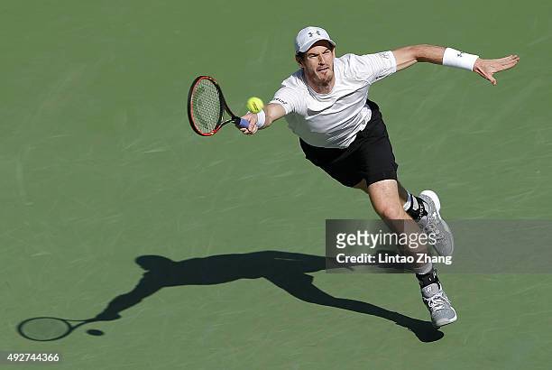 Andy Murray of Great Britain returns a shot against John Isner of the United States during the men's singles third round match on day 5 of Shanghai...