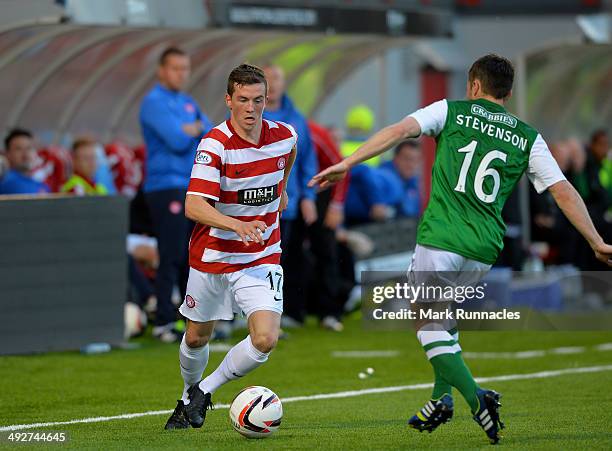 Louis Longridge , of Hamilton Academical takes on Lewis Stevenson of Hibernian during the Scottish Premiership Play-off Final First Leg, between...