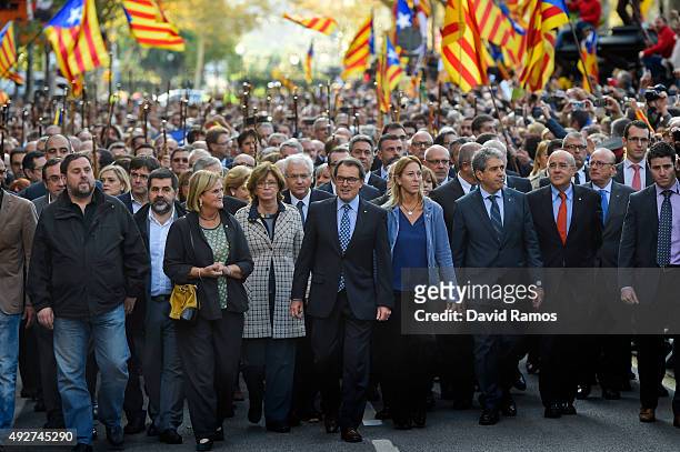 President of Catalonia Artur Mas surrounded by Catalonia Government members, deputies of the Parliament of Catalonia, mayors and representatives from...