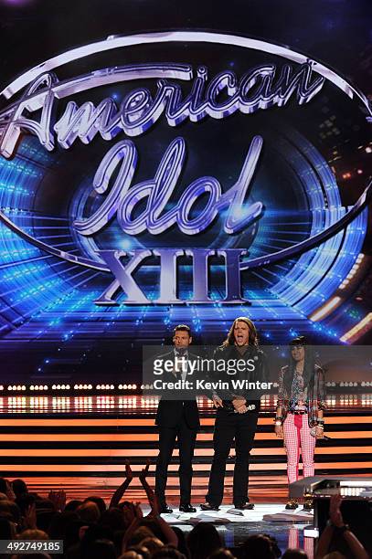 Host Ryan Seacrest, American Idol finalists Caleb Johnson and Jena Irene speak onstage during Fox's "American Idol" XIII Finale at Nokia Theatre L.A....