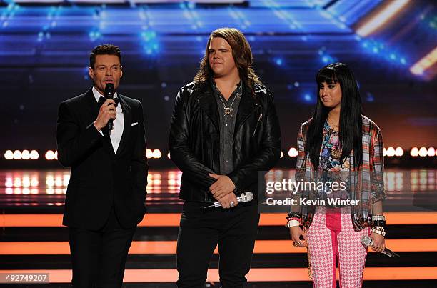 Host Ryan Seacrest, American Idol finalists Caleb Johnson and Jena Irene speak onstage during Fox's "American Idol" XIII Finale at Nokia Theatre L.A....