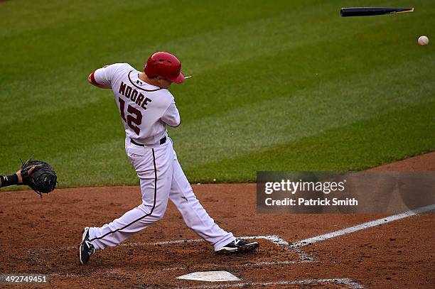 Tyler Moore of the Washington Nationals breaks his bat in the seventh inning against the Cincinnati Reds at Nationals Park on May 21, 2014 in...