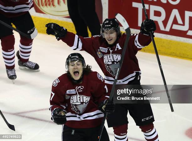 Tyler Bertuzzi of the Guelph Storm celebrates his goal at 2:23 of the second period against the London Knights along with Zack Mitchell during the...