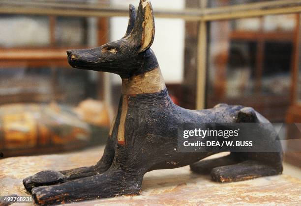 Statue of crouched Anubis, grave goods. Egyptian civilization, New Kingdom. Cairo, Egyptian Museum