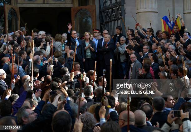Catalonia's regional government president and leader of the Catalan Democratic Convergence Artur Mas, waves as he exits the TSJC on October 15, 2015...