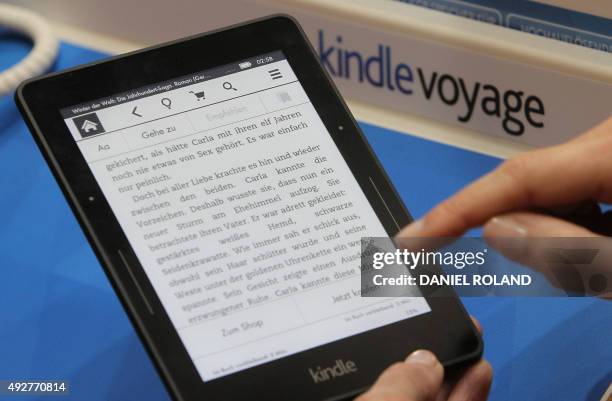 Kindle e-book reader is pictured at the Book Fair in Frankfurt, Germany, October 15, 2015. AFP PHOTO / DANIEL ROLAND