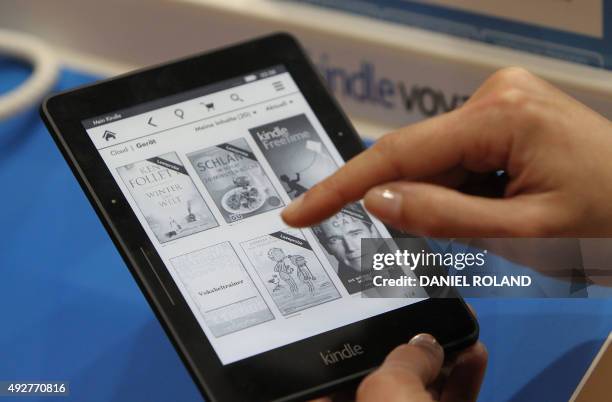 Kindle e-book reader is pictured at the Book Fair in Frankfurt, Germany, October 15, 2015. AFP PHOTO / DANIEL ROLAND