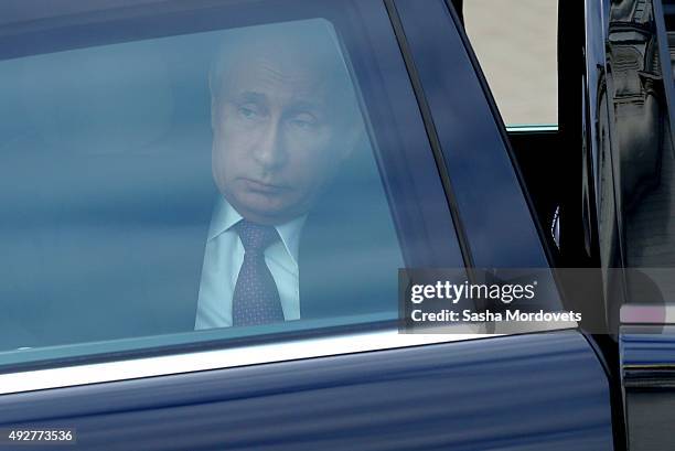 Russian President Vladimir Putin arrives at the Dormition Cathedral of Russian Orthodox Church on October 15, 2015 in Astana, Kazakhstan. Russian...