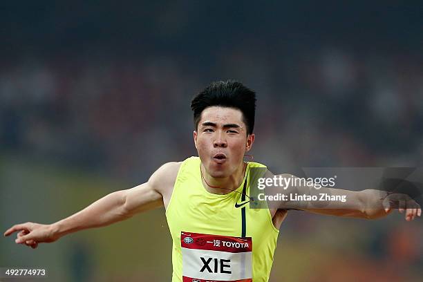 Xie Wenjun of China celebrates winning the men's 110-meter hurdles during 2014 IAAF World Challenge Beijing at National Stadium on May 21, 2014 in...