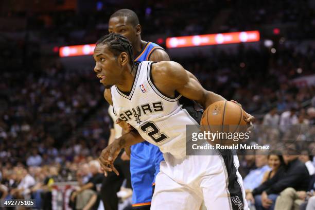 Kawhi Leonard of the San Antonio Spurs drives on Kevin Durant of the Oklahoma City Thunder in the first quarter in Game Two of the Western Conference...