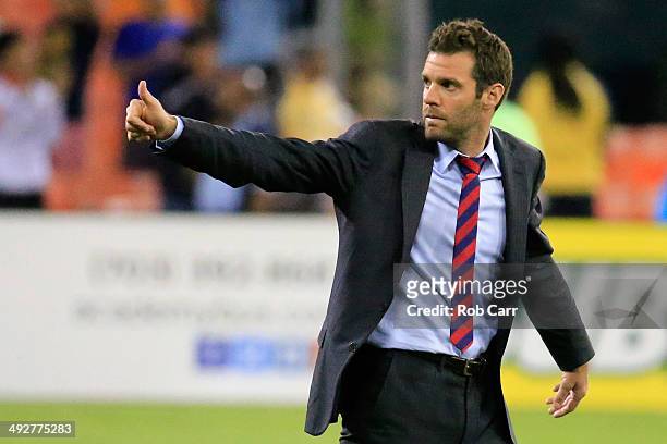 Head coach Ben Olsen of D.C. United gives the thumbs up to the crowd following their 2-0 win over the Houston Dynamo at RFK Stadium on May 21, 2014...