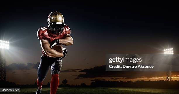 american-football in aktion - soccer glove stock-fotos und bilder