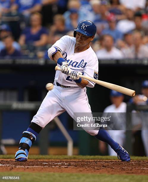 Norichika Aoki of the Kansas City Royals hits a RBI single in the third inning against the Chicago White Sox at Kauffman Stadium on May 21, 2014 in...
