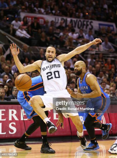 Manu Ginobili of the San Antonio Spurs is fouled by Derek Fisher of the Oklahoma City Thunder in the first half in Game Two of the Western Conference...
