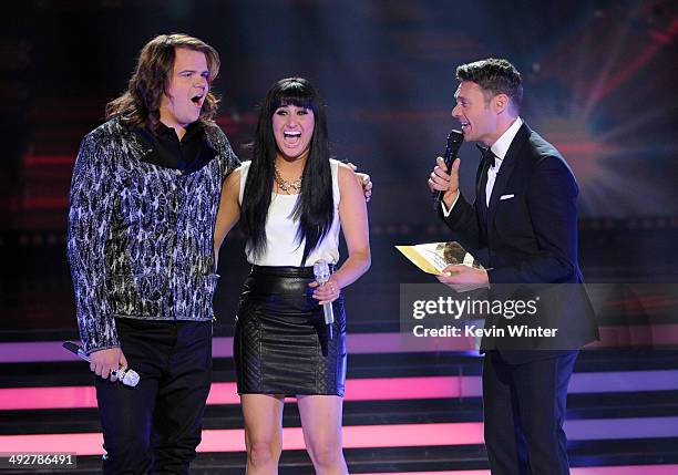 American Idol Finalists Caleb Johnson and Jena Irene wait for the results from host Ryan Seacrest onstage during Fox's "American Idol" XIII Finale at...