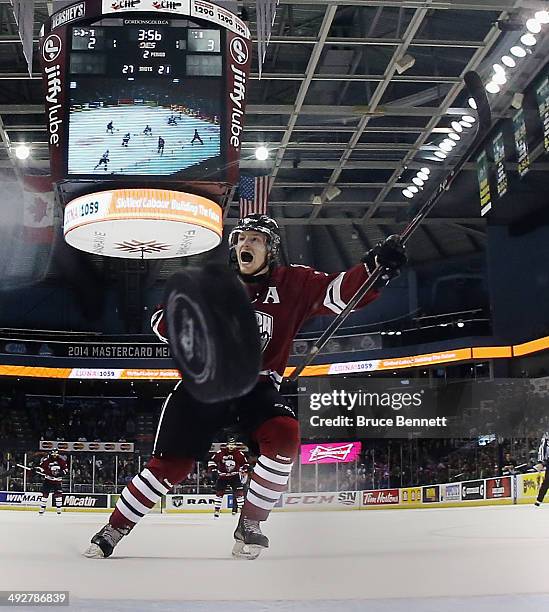 Brock McGinn of the Guelph Storm watches a shot by Tyler Bertuzzi go past Jake Patterson of the London Knights during the second period during the...