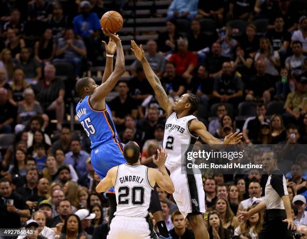 Kevin Durant of the Oklahoma City Thunder shoots over Kawhi Leonard of the San Antonio Spurs in the first half in Game Two of the Western Conference...