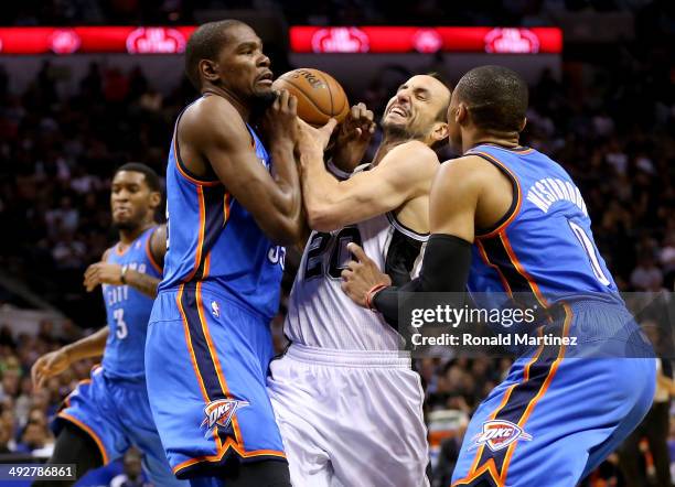 Manu Ginobili of the San Antonio Spurs drives on Kevin Durant and Russell Westbrook of the Oklahoma City Thunder in the first half in Game Two of the...
