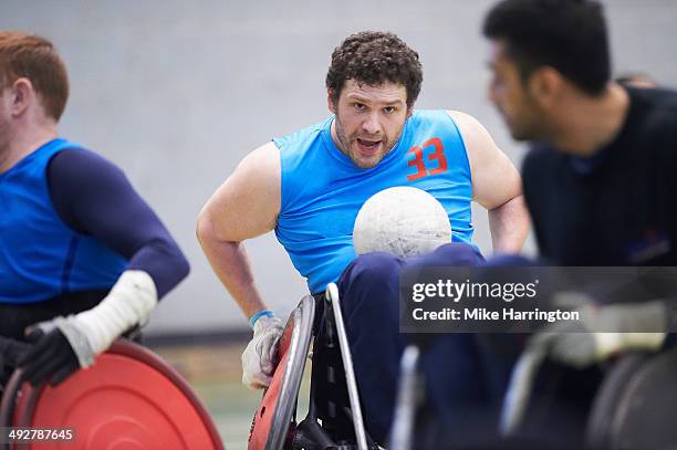 disabled male athlete playing wheelchair rugby - wheelchair rugby foto e immagini stock