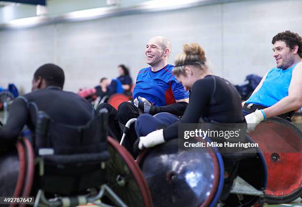 team of athletes enjoying wheelchair rugby - wheelchair rugby stock-fotos und bilder