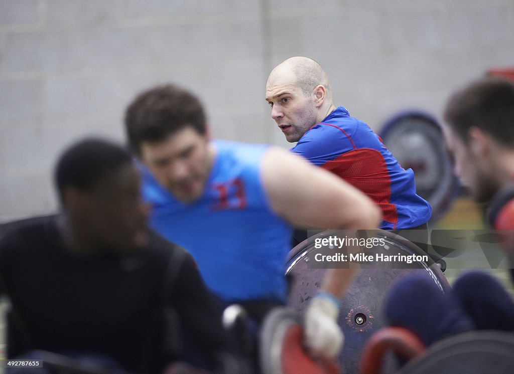 Disabled male athletes playing wheelchair rugby
