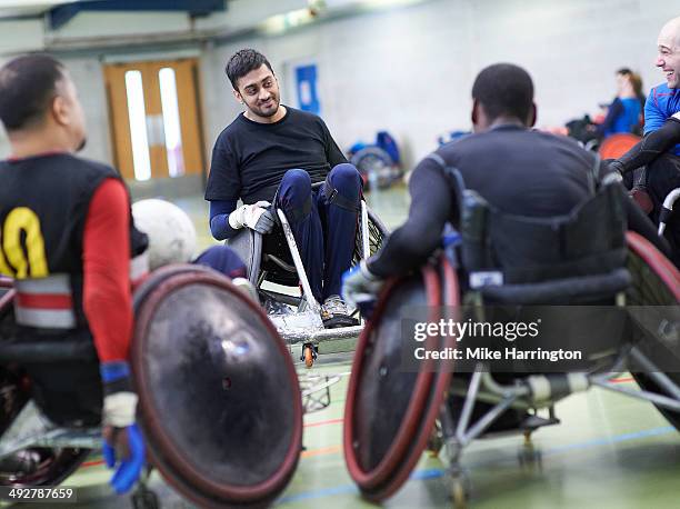 team of male wheelchair rugby athletes - wheelchair rugby stock-fotos und bilder