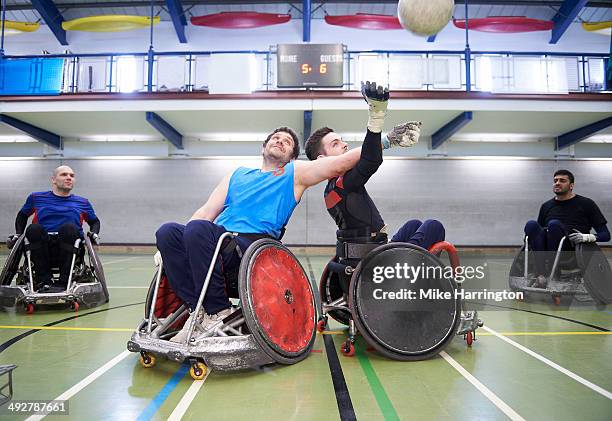 wheelchair rugby tackle between two males - wheelchair rugby stock-fotos und bilder