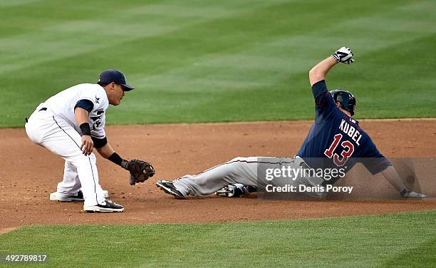 Jason Kubel of the Minnesota Twins steals second base ahead of the tag of Everth Cabrera of the San Diego Padres during the second inning of a...
