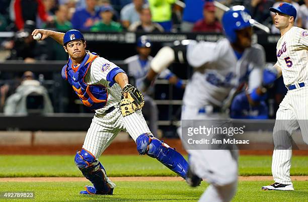 Anthony Recker of the New York Mets throws out Dee Gordon of the Los Angeles Dodgers in the eighth inning at Citi Field on May 21, 2014 in the...