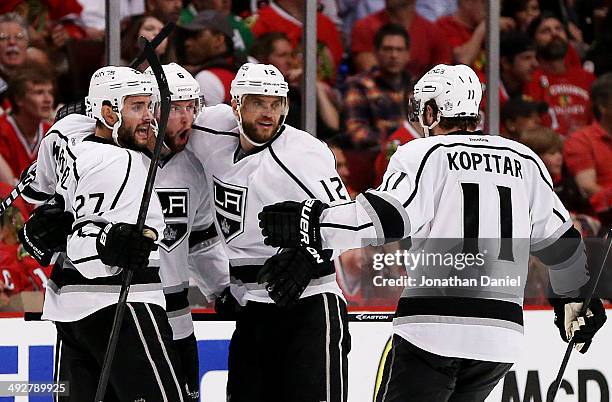 Jake Muzzin of the Los Angeles Kings celebrates his goal with teammates in the third period against the Chicago Blackhawks in Game Two of the Western...