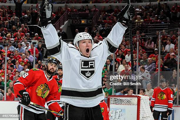 Tyler Toffoli of the Los Angeles Kings reacts after scoring against the Chicago Blackhawks in the third period, as Nick Leddy of the Blackhawks...