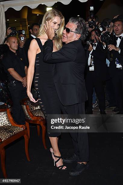 Rosie Huntington-Whiteley and Roberto Cavalli attend the "Roberto Cavalli Annual Party Aboard" : Outside Arrivals at the 67th Annual Cannes Film...