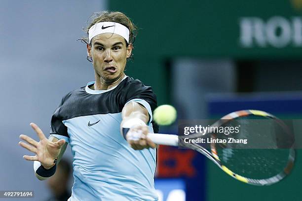 Rafael Nadal of Spain returns a shot against Milos Raonic of Canada during the men's singles third round match on day 5 of Shanghai Rolex Masters at...
