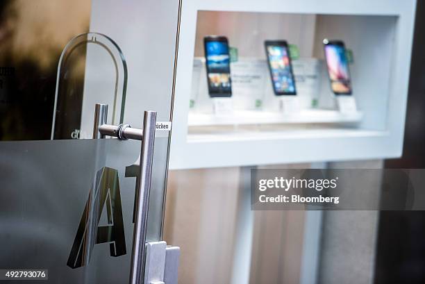 An A1 logo sits on the door of an A1 store, operated by Telekom Austria AG, in Vienna, Austria, on Wednesday, Oct. 14, 2015. Telekom Austria is...