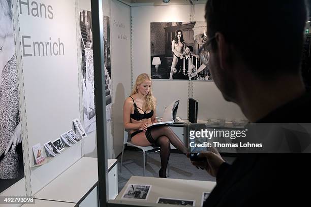 Photographer Hans Emrich pictures a model at the 2015 Frankfurt Book Fair on October 15, 2015 in Frankfurt am Main, Germany. The 2015 fair, which is...