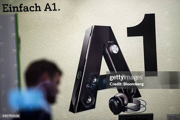 An A1 logo sits in the window display of an A1 store, operated by Telekom Austria AG, in Vienna, Austria, on Wednesday, Oct. 14, 2015. Telekom...