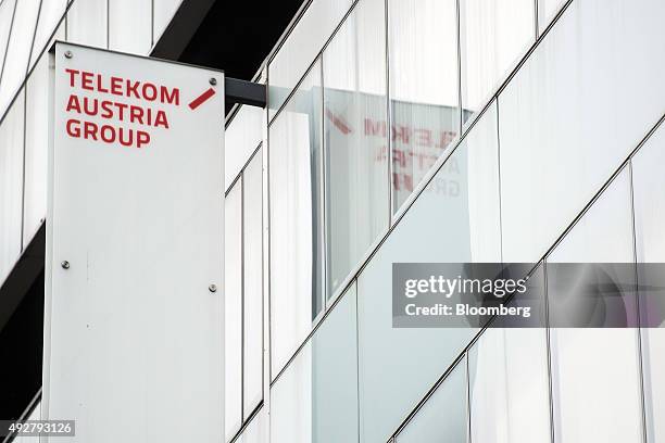 Sign sits on the side of the Telekom Austria AG headquarters in Vienna, Austria, on Wednesday, Oct. 14, 2015. Telekom Austria is weighed on by...