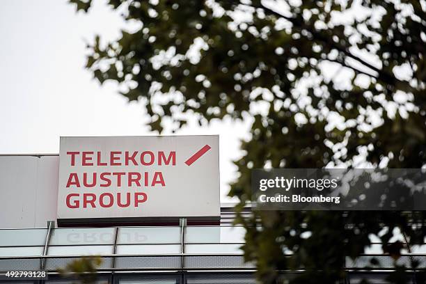 Sign sits on top of the Telekom Austria AG headquarters in Vienna, Austria, on Wednesday, Oct. 14, 2015. Telekom Austria is weighed on by uncertainty...