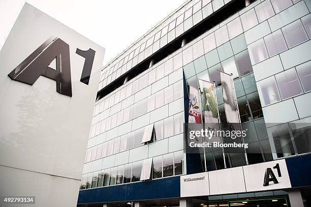 Sign sits outside the entrance to the Telekom Austria AG headquarters in Vienna, Austria, on Wednesday, Oct. 14, 2015. Telekom Austria is weighed on...