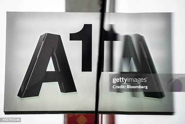 An A1 logo sits on a sign outside an A1 store, operated by Telekom Austria AG, in Vienna, Austria, on Wednesday, Oct. 14, 2015. Telekom Austria is...