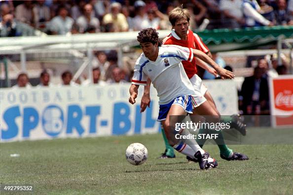 French football palyer JeanMarc Ferreri fights for the ball against