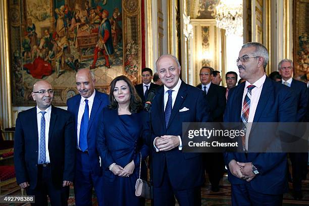 French Foreign Minister Laurent Fabius speaks to the media after his meeting with Tunisian lawyer Fadhel Mahfoudh, Abdessatar Ben Moussa, Head of...