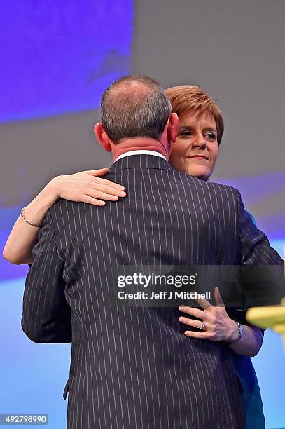 Leader Nicola Sturgeon congratulates shadow chancellor and deputy leader Stuart Hosie following his addresses to the 81st annual conference at the...