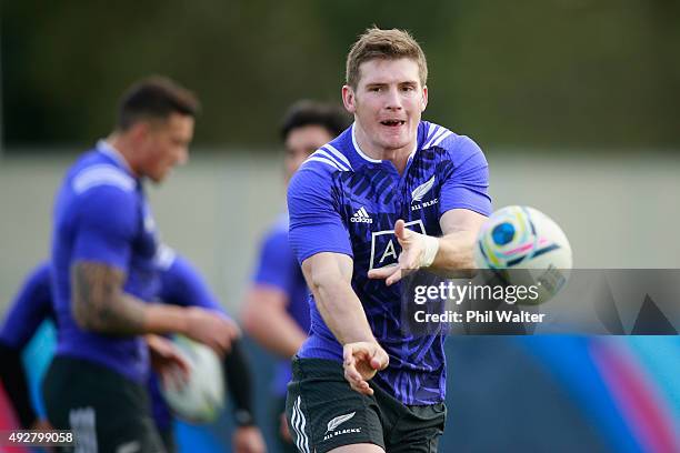 Colin Slade of the All Blacks passes during a New Zealand All Blacks training session at Swansea University on October 15, 2015 in Swansea, United...